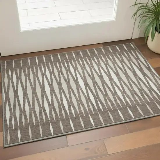 Brown And Ivory Geometric Washable Area Rug With UV Protection Photo 2