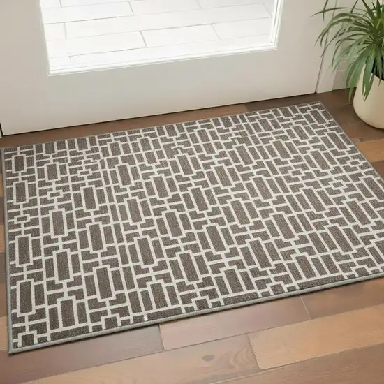 Brown And Ivory Geometric Washable Area Rug With UV Protection Photo 2