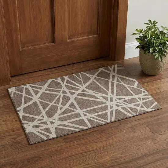 Brown And Ivory Geometric Washable Area Rug With UV Protection Photo 1