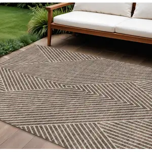 Photo of Brown And Ivory Geometric Washable Indoor Outdoor Area Rug