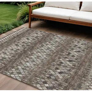 Photo of Brown And Ivory Ikat Washable Indoor Outdoor Area Rug