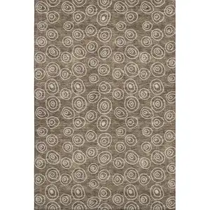Photo of Brown And Ivory Polka Dot Washable Area Rug With UV Protection