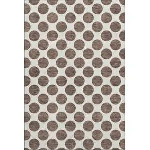 Photo of Brown And Ivory Polka Dot Washable Area Rug With UV Protection