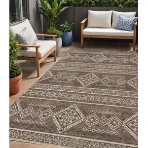Photo of Brown And Ivory Southwestern Washable Indoor Outdoor Area Rug
