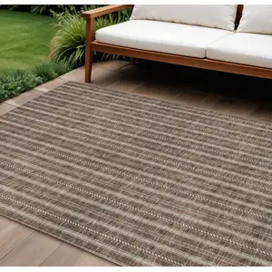 Photo of Brown And Ivory Striped Washable Indoor Outdoor Area Rug