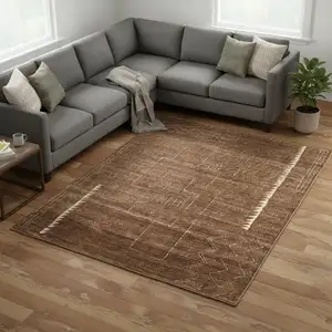 Photo of Brown And Ivory Wool Abstract Hand Knotted Distressed Area Rug