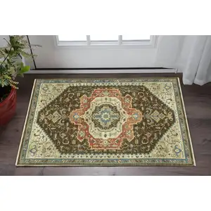 Photo of Brown And Orange Oriental Area Rug With Fringe