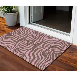 Photo of Brown And Pink Animal Print Washable Indoor Outdoor Area Rug
