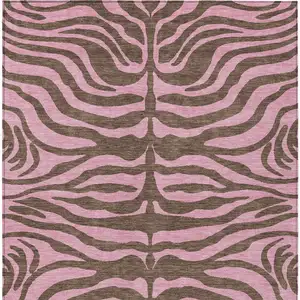 Photo of Brown And Pink Animal Print Washable Indoor Outdoor Area Rug