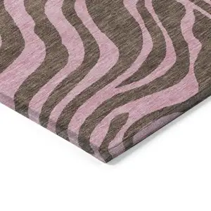 Photo of Brown And Pink Animal Print Washable Indoor Outdoor Area Rug