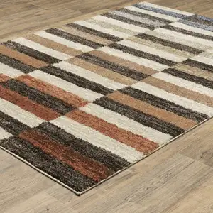 Photo of Brown And Rust Geometric Area Rug