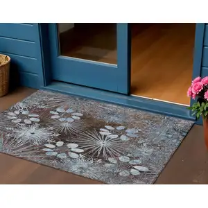 Photo of Brown And Sky Blue Floral Washable Indoor Outdoor Area Rug