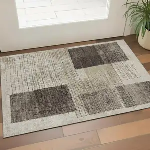 Photo of Brown And Taupe Geometric Washable Area Rug With UV Protection