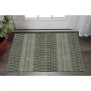 Photo of Brown And Taupe Tribal Washable Area Rug With UV Protection