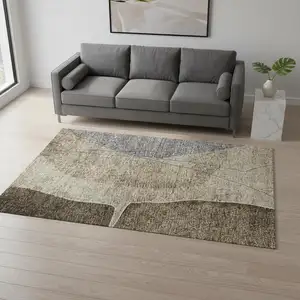 Photo of Brown Beige And Blue Abstract Washable Area Rug With UV Protection
