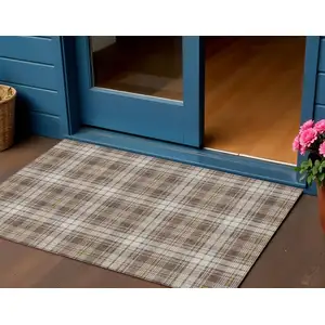 Photo of Brown Beige And Gold Plaid Washable Indoor Outdoor Area Rug