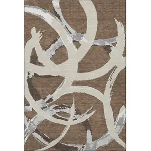 Photo of Brown Beige And Gray Abstract Washable Area Rug With UV Protection