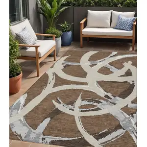 Photo of Brown Beige And Gray Abstract Washable Indoor Outdoor Area Rug