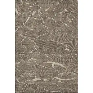 Photo of Brown Beige And Ivory Abstract Washable Area Rug With UV Protection