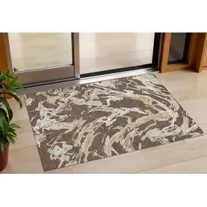 Photo of Brown Beige And Ivory Abstract Washable Indoor Outdoor Area Rug