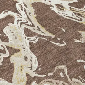 Photo of Brown Beige And Ivory Abstract Washable Indoor Outdoor Area Rug