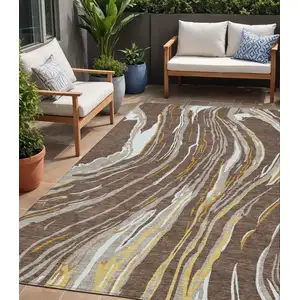 Photo of Brown Beige And Ivory Abstract Washable Indoor Outdoor Area Rug