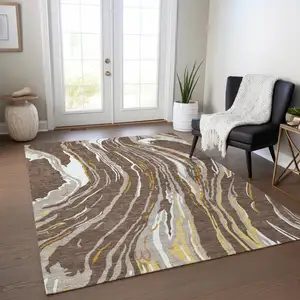 Photo of Brown Beige And Ivory Abstract Washable Indoor Outdoor Area Rug