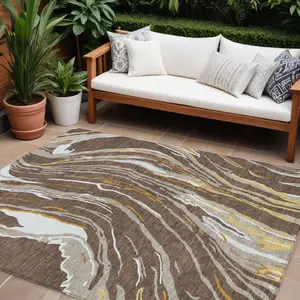 Photo of Brown Beige And Ivory Abstract Washable Indoor Outdoor Area Rug