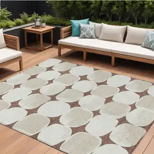 Photo of Brown Beige And Ivory Abstract Washable Indoor Outdoor Area Rug