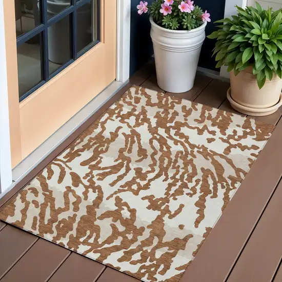 Brown Beige And Ivory Animal Print Washable Indoor Outdoor Area Rug Photo 1