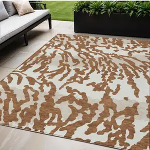 Photo of Brown Beige And Ivory Animal Print Washable Indoor Outdoor Area Rug