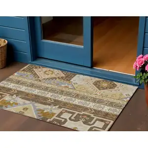 Photo of Brown Beige And Ivory Aztec Washable Indoor Outdoor Area Rug