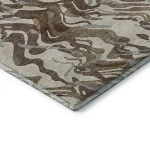 Photo of Brown Beige And Taupe Abstract Washable Area Rug With UV Protection