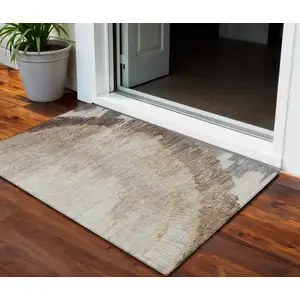 Photo of Brown Beige And Taupe Abstract Washable Indoor Outdoor Area Rug