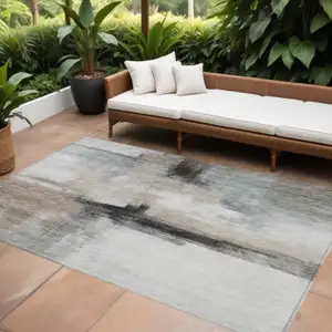 Photo of Brown Black And Gray Abstract Washable Indoor Outdoor Area Rug