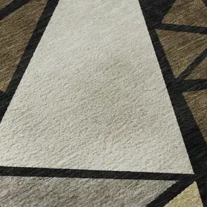 Photo of Brown Black And Ivory Geometric Washable Area Rug With UV Protection