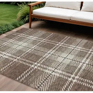 Photo of Brown Black And Ivory Plaid Washable Indoor Outdoor Area Rug