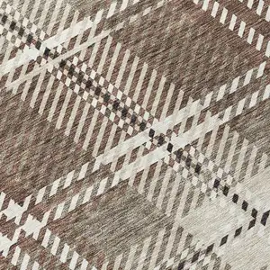 Photo of Brown Black And Ivory Plaid Washable Indoor Outdoor Area Rug