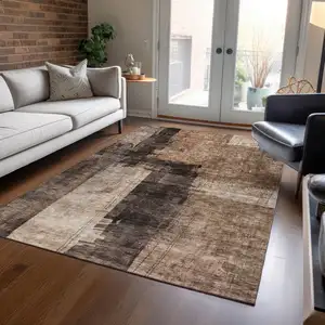 Photo of Brown Black And Tan Abstract Washable Indoor Outdoor Area Rug