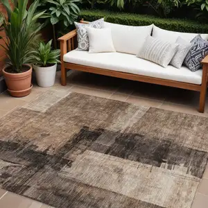 Photo of Brown Black And Tan Abstract Washable Indoor Outdoor Area Rug