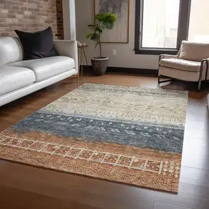 Photo of Brown Blue And Beige Southwestern Washable Indoor Outdoor Area Rug