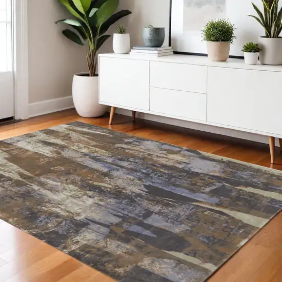 Brown Blue And Ivory Abstract Distressed Area Rug Photo 1