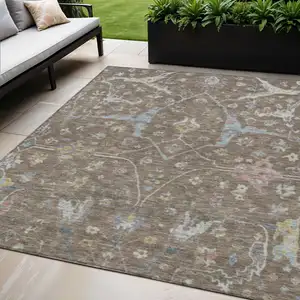 Photo of Brown Blue And Ivory Floral Washable Indoor Outdoor Area Rug