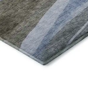 Photo of Brown Blue And Silver Abstract Washable Area Rug With UV Protection