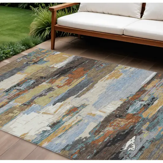 Brown Blue Ivory And Gold Abstract Washable Indoor Outdoor Area Rug Photo 1