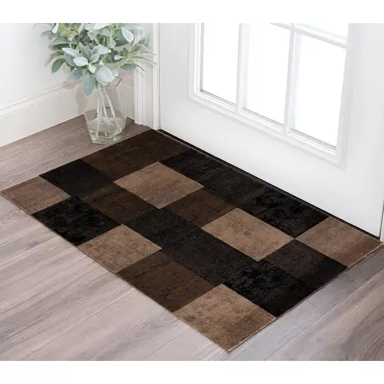 Black And Brown Geometric Distressed Area Rug Photo 1