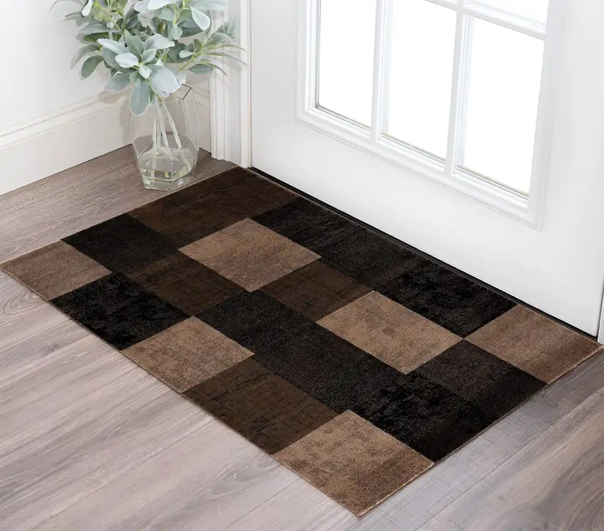 Black And Brown Geometric Distressed Area Rug Photo 1
