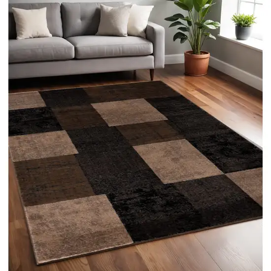 Black And Brown Geometric Distressed Area Rug Photo 1