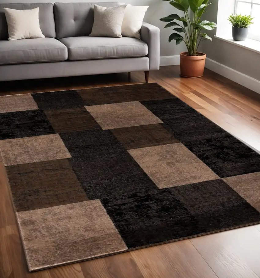 Black And Brown Geometric Distressed Area Rug Photo 1