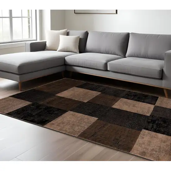Black And Brown Geometric Distressed Area Rug Photo 1